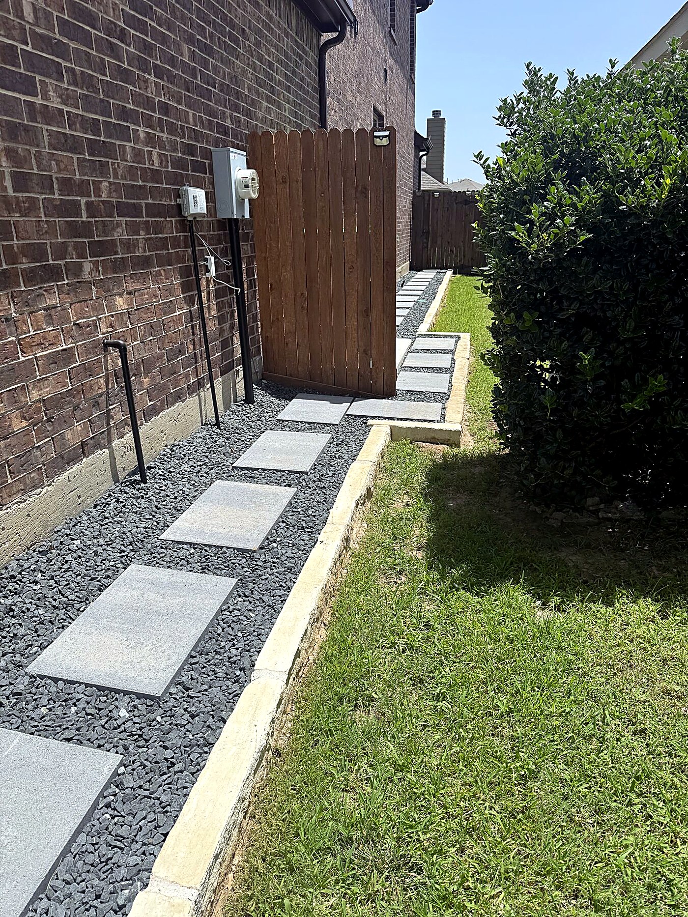 Finished paver pathway with stone border